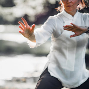 Woman practicing qigong movements