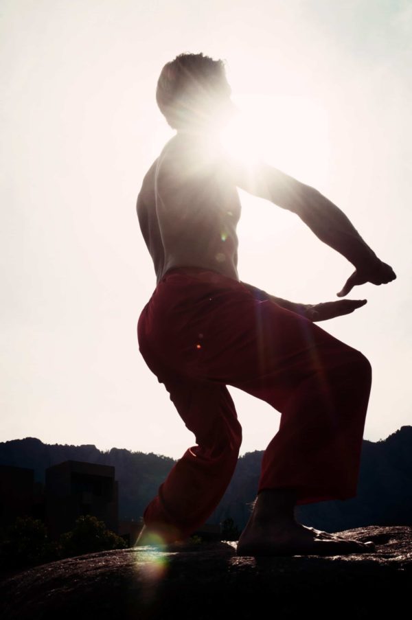 Instructor David J. Coon picture of Qigong Exercise with sunlight shining