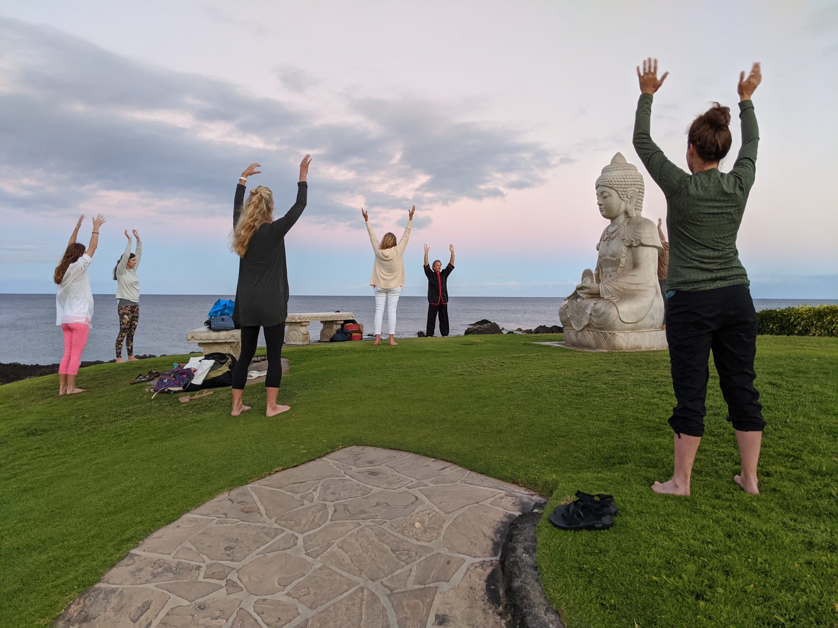 Photo taken in Hawaii overlooking ocean with Qigong Awareness students practicing Qigong