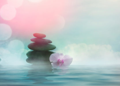 Dreamy landscape with a cairn and clouds