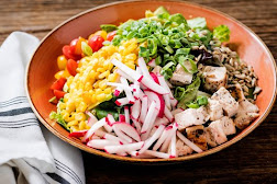 grain bowl with assortment of vegetables and tofu